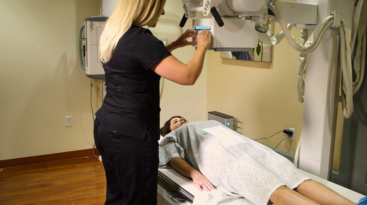 A technician from Scottsdale Medical Imaging using diagnostic imaging on a patient.