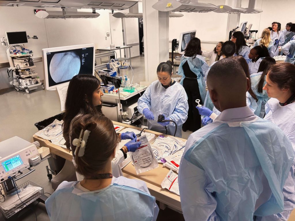 A group of medical professionals use endoscopy equipment